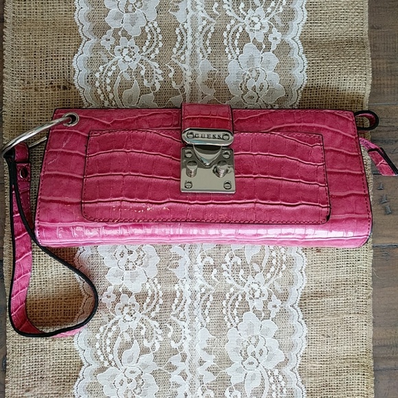 guess pink clutch